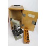 Two microscopes in wooden carry cases