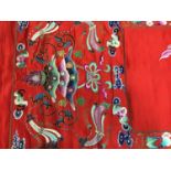 Large Chinese embroidered red silk wall hanging. Polychrome silk thread embroidered colourful cocker