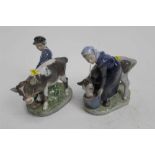 Two Royal Copenhagen figures - Girl and Boy feeding calves