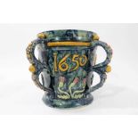 Castle Hedingham Edward Bingham blue glazed pottery four handled jug / loving cup with applied flora