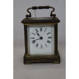 Brass carriage clock with white enamel dial