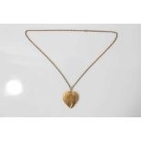 9ct gold large heart shaped locket on a yellow metal chain