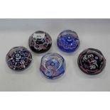 Five Whitefriars commemorative glass paperweights