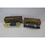 Hornby Racing boat no. 2 in original box plus Sutcliffe tin plate boat.