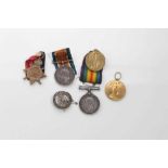 First World War 1914-15 Star trio, together with a First World War pair and a silver War badge