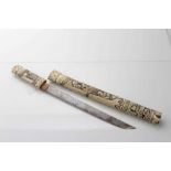 Late 19th Japanese tanto dagger in ornately carved bone scabbard with Figural decoration, blade 27cm