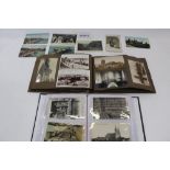 Postcards in album and loose including Hold to Light Christmas, Angels, other greetings, topography,