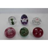 Seven various glass paperweights three Teign Valley, one Royal Brierley, one Isle of Man and one cry