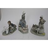 Three Lladro figures - girl with pigs, girl with goats and girl with geese