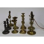 Three late 19th Century ship’s gimbal lamps, other candlesticks