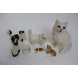 Group five Beswick cat ornaments, together with a Royal Doulton cat and dog ornament (7)