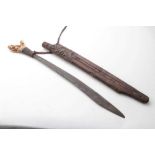 Borneo Dayak Head hunters sword with carved bone hilt with rope bound grip, in carved wood scabbard