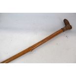 Late 19th / early 20th century Holly walking cane with carved handle in the form of a boot, 100.5cm