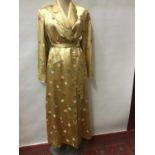 Ladies Chinese vintage gold silk brocade dressing gown. Shaped pocket flaps and traditional Chinese