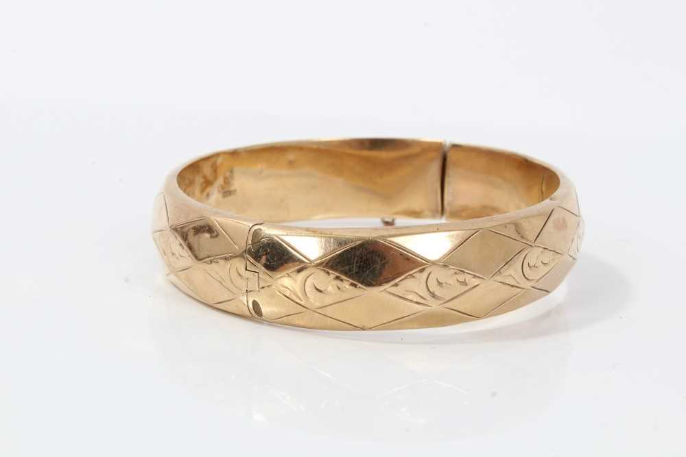 9ct gold hinge bangle with geometric and scroll decoration