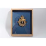 Edwardian bi-metal Norfolk Regiment Officers' helmet plate, mounted in glazed frame