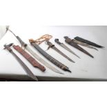 Borneo Dayak Head hunters sword, together with a group of four other Eastern swords and daggers (5)