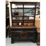 Antique oak dresser with plate rack above, two drawers and panelled doors with geometric mouldings