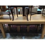 Good quality light oak dining table together with a set of Lloyd Loom Eastward wicker dining room ch