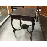 Edwardian mahogany envelope top card table with drawer on carved cabriole legs with undertier