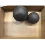 Two metal cannon balls