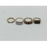 Four gold dress rings