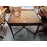 Contemporary two tier table with chess board top and another similar with X framed stretcher