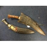 Two Kukri knives in scabbards