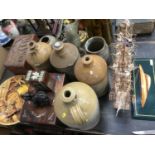 Half model of a boat, stoneware jars and wooden boxes