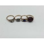 Four 9ct gold gem set dress rings