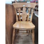 Two pine kitchen chairs and a pine stool