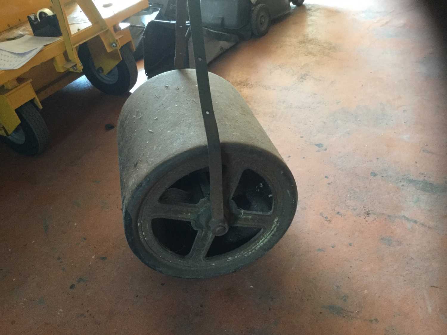 Antique lawn roller with iron frame