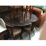 Ercol drop leaf table together with a set of six Ercol chairs