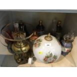 Group of Wade Whisky Decanters, oil lamps, and Wade Veteran cars tankards