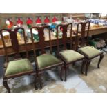 Set four Queen Anne-style mahogany dining chairs on cabriole legs