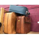 Three small suit cases