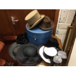 Hat box containing vintage ladies hats, top hat and trilby hat