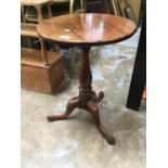 Georgian mahogany circular wine table with snap top, turned column on tripod base.The top 46cm diame