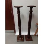 Pair of mahogany torchere stands