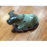 Chinese jade model of a water buffalo on a wooden base