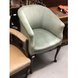Blue upholstered tub chair with cabriole legs