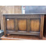 Oak coffer with panelled front