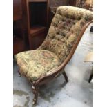 Victorian carved walnut framed nursing chair with floral upholstery on cabriole legs