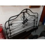 Metal bed with side irons and slats