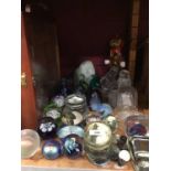 Group of paper weights, ornamental stones and display case