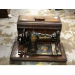 Three vintage sewing machines in cases including Bradbury's