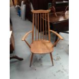 Two Ercol light elm stick back chairs