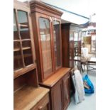 Victorian mahogany two height bookcase with two glazed doors above enclosing adjustable shelves and