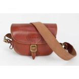 Good quality leather cartridge bag with canvas strap, P.A.L.S. initials, together with a box of 25 A