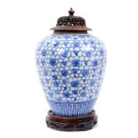 19th century Japanese blue and white porcelain jar, painted with prunus blossom, with carved